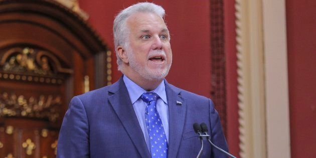 Quebec Premier Philippe Couillard speaks after presenting his new cabinet at the National Assembly in Quebec City on Wednesday.