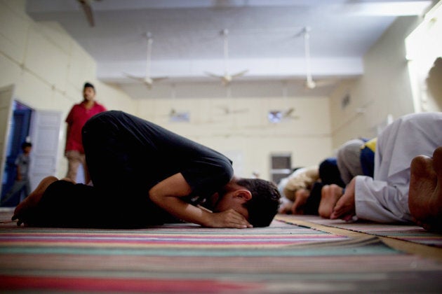 Members of the persecuted Ahmadiyya community pray in a mosque on July 14, 2010 in Chenab Nagar, Pakistan.