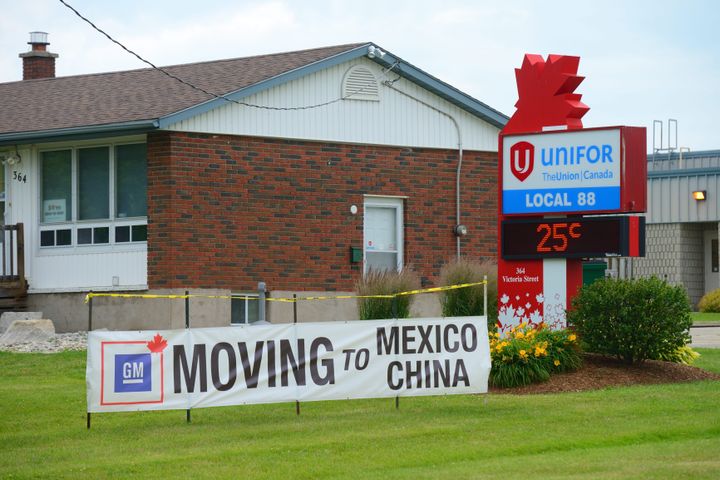 Unifor sign saying Moving to Mexico, China. The sign is protesting General Motors moving CAMI Automotive assembly plant jobs out of Canada in Ingersoll on June 30, 2017.