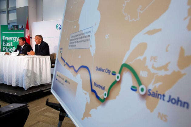 TransCanada President and CEO Russ Girling, right, announces the Energy East Pipeline during a news conference in Calgary, Alta. on August 1, 2013.