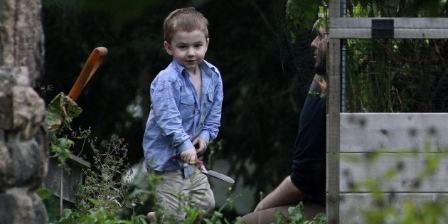 Joshua Boyle and his son Jonah play in the garden at his parents' house in Smiths Falls, Ont., Oct. 14, 2017.