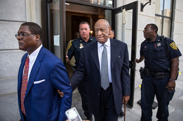 Bill Cosby, centre, leaves the courthouse after details of the new trial were decided by the court at the Montgomery County Courthouse in Norristown, Pa. on August 22, 2017.