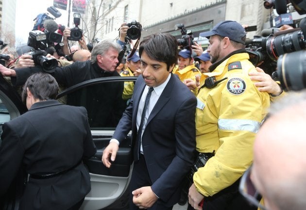 Jian Ghomeshi leaving College Park Court with his lawyer, Marie Henein, after Ghomeshi was released on $100,000 bail.