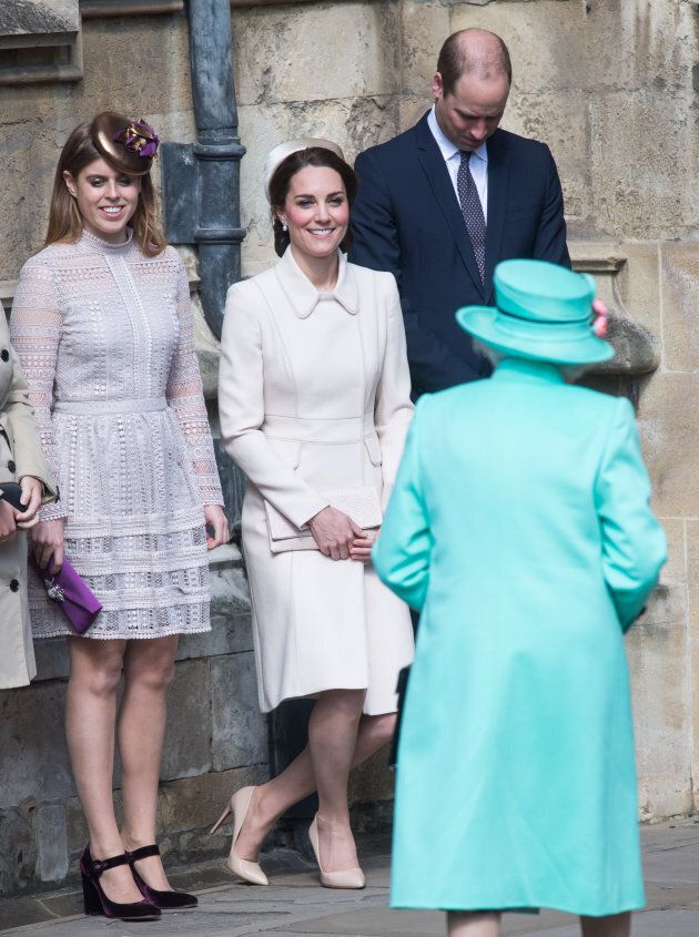 The Duchess of Cambridge curtsies in front of the Queen.