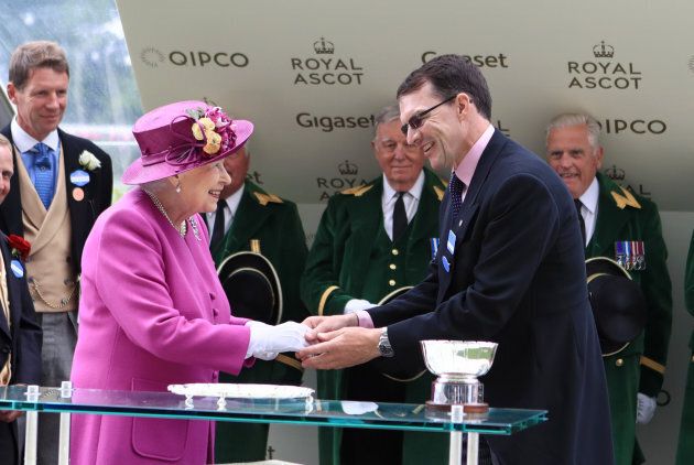 Trainer Aiden O'Brien shakes hands with Queen Elizabeth II after winning the Hardwicke Stakes with horse Idaho.