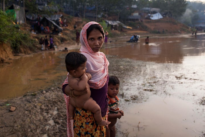 On 12 September 2017, Nasima Khatu 25, carries her child Nazima Khatu 6 months old, at Kutupalong Makeshift Camp in Coxâs Bazar district in Bangladesh. Her husband is unwell with a high fever, they have set up a makeshift shelter in the newly built Kutupalong Makeshift Camp. By 5 September 2017, more than 146,000 Rohingya refugees fled across the border from Rakhine State, Myanmar, into Cox's Bazar district, Chittagong Division in Bangladesh since 25 August. As many as 80 per cent of the new arrivals are women and children. More than 70 000 children need urgent humanitarian assistance. More than 100,000 of the newly arrived refugees are currently residing in makeshift settlements and official refugee camps that are extremely overcrowded while 10,000 newly arrived refugees are in host communities. In addition, 33,000 arrivals are in new spontaneous sites, which are quickly expanding. While some refugees are making their own shelters, the majority of people are staying in the open, suffering from exhaustion, sickness and hunger. Coxâs Bazar district of Bangladesh is one of the most vulnerable districts, not only for its poor performance in child related indicators but also for its vulnerability to natural hazards. Most people walked 50 or 60 kilometers for up to six days and are in dire need of food, water and protection. Many children are suffering from cold fever as they are drenched in rain and lack additional clothes. Children and adolescents, especially girls, are vulnerable to trafficking as different child trafficking groups are active in the region. Many more children in need of support and protection remain in the areas of northern Rakhine State that have been wracked by violence. In Bangladesh, UNICEF is scaling up its response to provide refugee children with protection, nutrition, health, water and sanitation support. With the recent influx of refugees, demand has increased and UNICEF is working to mobilize more support and strengthen its exist