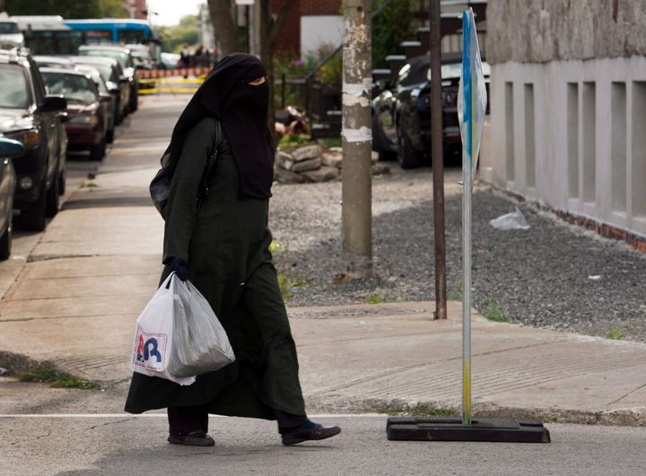 A woman wears a niqab as she walks on Sept. 9, 2013 in Montreal.