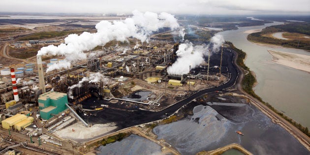 The Suncor oilsands processing plant on the Athabasca River near Fort McMurray, Alta., Sept. 17, 2014. With oil prices in a prolonged slump, Canada's oil firms are retrenching.