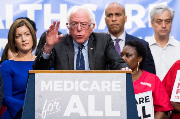 Dr. Danielle Martin (left) watches as Sen. Bernie Sanders speaks during his event to introduce the Medicare for All Act of 2017 on Sept. 13, 2017.