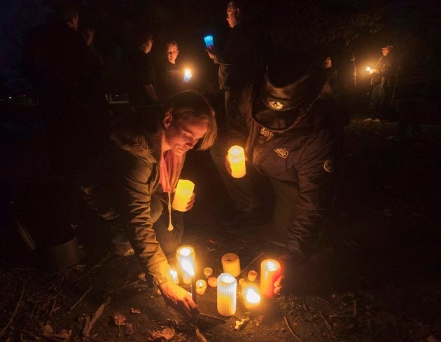 Fans of the Tragically Hip gather for a candlelight vigil by the water's edge in Bobcaygeon Ont. on Wednesday to pay tribute to singer Gord Downie who died on Tuesday night at the age of 53.