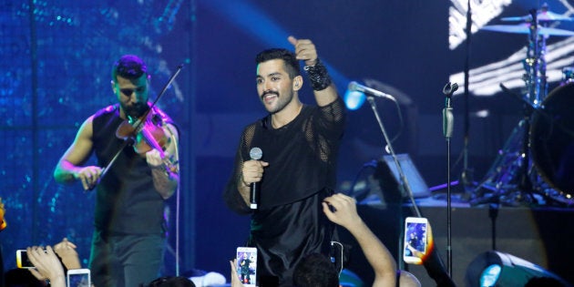 Hamed Sinno (R), the lead singer of Lebanese alternative rock band Mashrou' Leila performs during the Ehdeniyat International Festival in Ehden town, Lebanon Aug. 12, 2017.