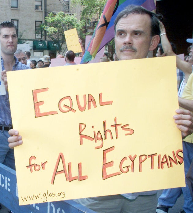 Protestors march near the Egyptian consulate in New York City on Aug. 15, 2001 carrying signs critical of the Egyptian government's detention of 52 allegedly gay men.