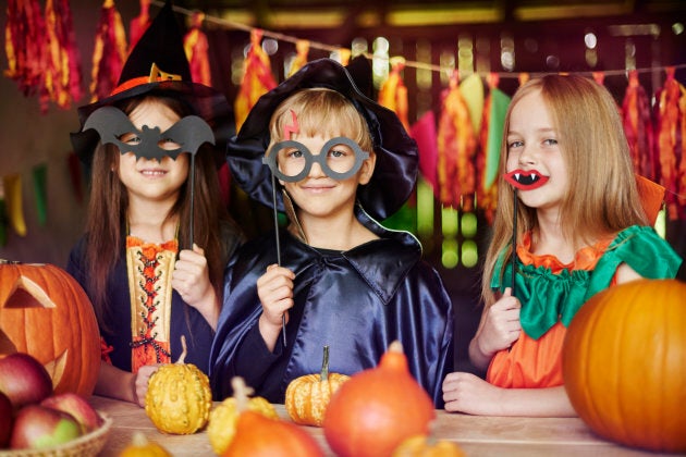 Stock photo of children dressed up for Halloween in imaginative costumes.