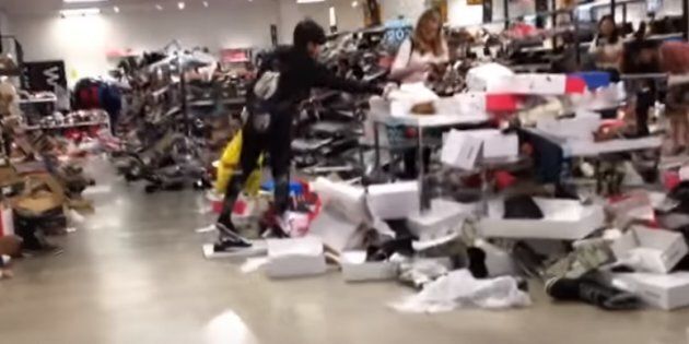 A screengrab from a YouTube video shows a chaotic scene at one of Sears Canada's stores during liquidation.
