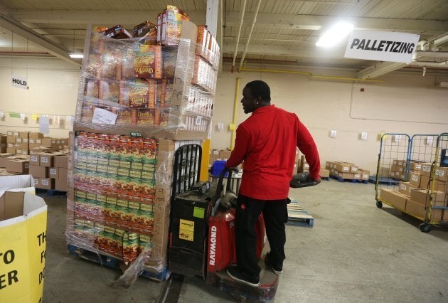 Volunteers from Target team members (employees) help sort and pack food items and more at the Daily Bread Food Bank.