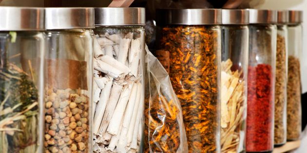 Traditional chinese medicine herbs and remedies in jars.