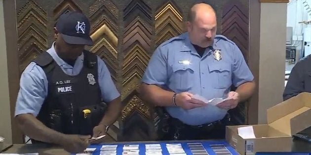 Officers from Kansas City, Kansas Police Department collecting business cards to give to a family of a late police officer from Iowa on Oct. 25, 2017.