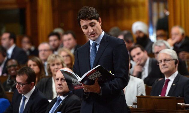 Prime Minister Justin Trudeau reads from his party's 2015 platform in the House of Commons on Oct. 18, 2017.