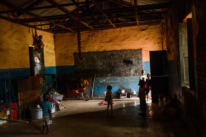 Children play in a classroom which families use as a shelter to sleep in at night, on the grounds of St. Mary's cathedral, which is host to thousands of internally displaced persons, Wau, Western Bahr el Ghazal, South Sudan, Thursday, June 15, 2017.