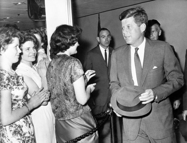 American President John F Kennedy chats with staff at the U.S. Embassy in London.