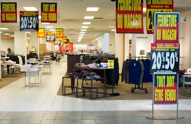 Discount signs at a Sears store in the Fairview mall in Montreal, Tuesday, Oct. 24.