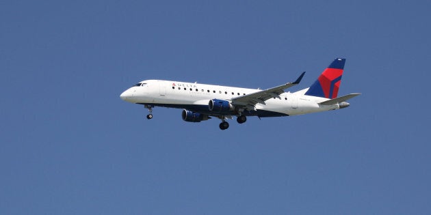 A Delta Airlines Embraer 175, with Tail Number N604CZ, lands at San Francisco International Airport, April 14, 2015.