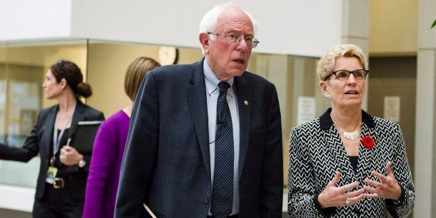 U.S. Sen. Bernie Sanders meets Ontario Premier Kathleen Wynne on a visit to the Women's College Hospital in Toronto on Saturday.