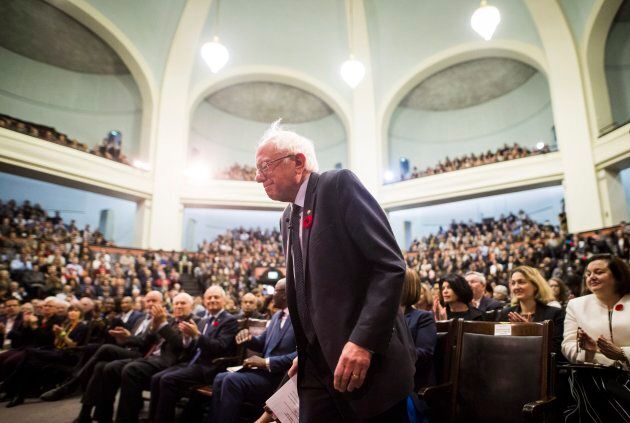 U.S. Senator Bernie Sanders gets up to speak at the University of Toronto on Oct. 29, 2017.