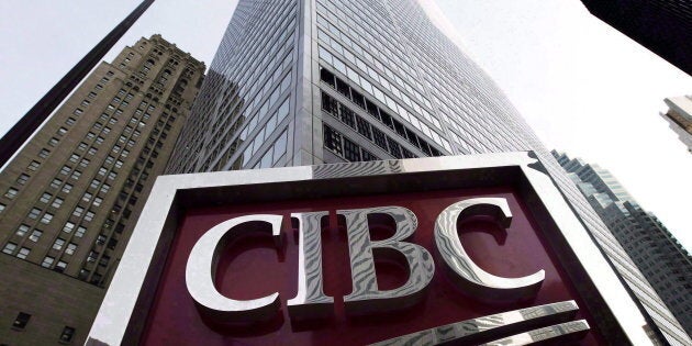 A CIBC sign in Toronto's financial district, Thurs. Feb. 26, 2009. CIBC says in a new report that the Canadian dollar is likely to come under pressure in coming months.