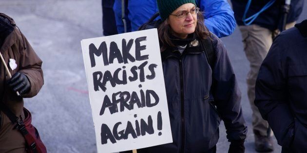 A participant in an anti-racism protest march is seen in Montreal, Que. on Sunday, Nov. 12, 2017.