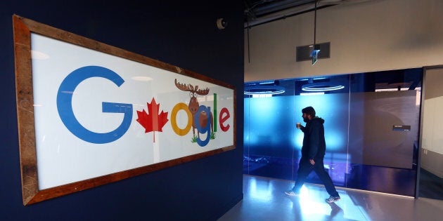 An employee walks in a hallway at Google Canada's engineering headquarters in Waterloo, Ont. on Jan. 22, 2016.