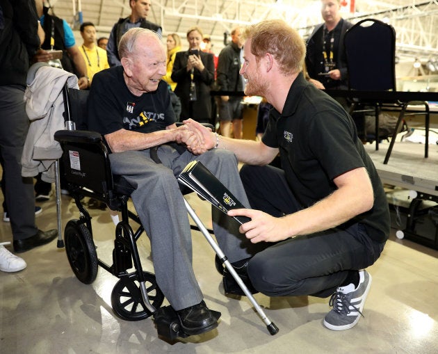 Prince Harry shakes hands with 101-year-old WW2 veteran Norm Baker on day six of the Invictus Games on Sept. 28, 2017 in Toronto.