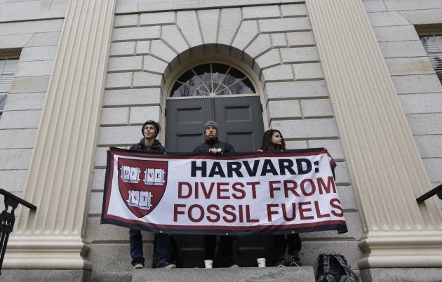 Students demanding that Harvard University divest from fossil fuels block the entrance to University Hall on the school's campus on Mar. 28, 2017.