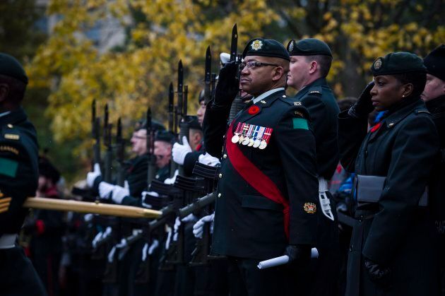 Members of the Canadian Military stand in formation during Remembrance Day service at Queens Park in Toronto.
