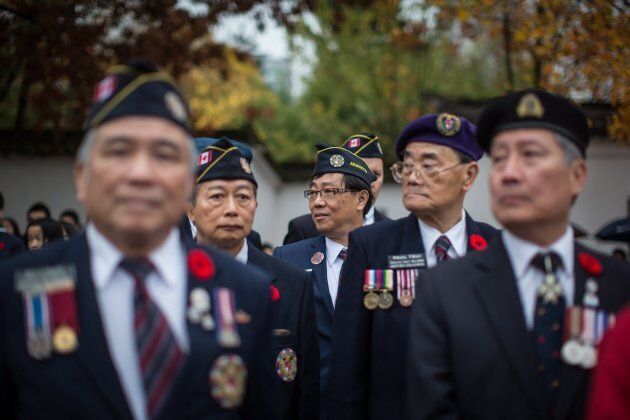 Veterans wait to march during a Remembrance Day ceremony honouring the sacrifices of the early Chinese pioneers and Chinese-Canadian military veterans, in Chinatown in Vancouver.