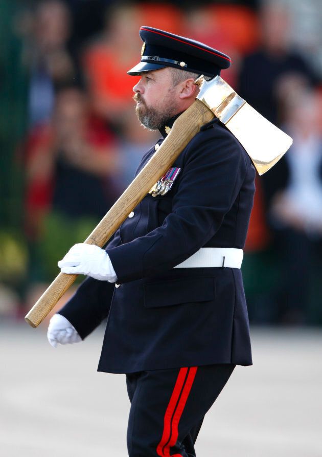 A bearded Pioneer Sergeant (the only soldier in the British Army allowed to wear a beard) carries a Pioneer Axe (the symbol of the Pioneer Regiment) during the 23 Pioneer Regiment RLC Disbandment Parade at St David's Barracks on Sept. 26, 2014 in Bicester, England.