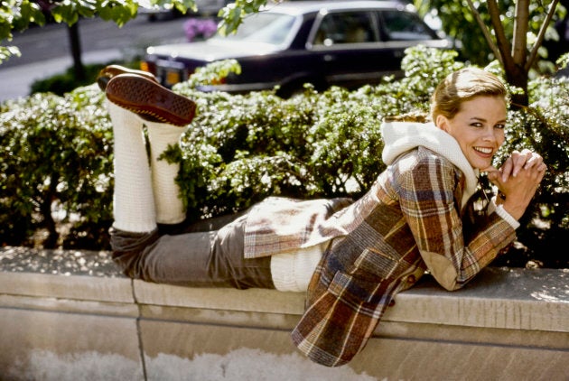 Model Lisa Taylor wearing a Ralph Lauren plaid hooded jacket corduroy jeans and leg warmers.