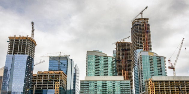 Condo and office towers under construction along Toronto's waterfront. Toronto's shortage of housing will keep the city's prices rising, and the same is true of Vancouver, says a new CIBC report.