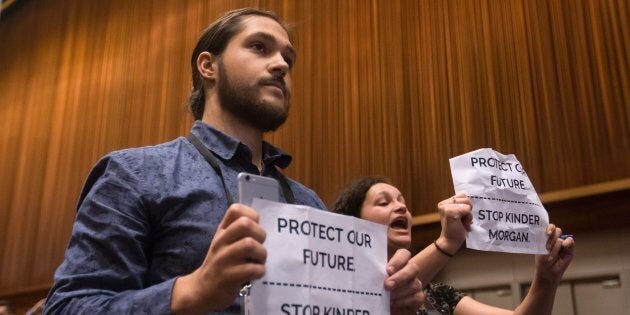 Protesters opposed to the Kinder Morgan Trans Mountain Pipeline expansion interrupt Prime Minister Justin Trudeau's news conference during the 2017 United Nations Peacekeeping Defence Ministerial conference in Vancouver on Nov. 15, 2017.