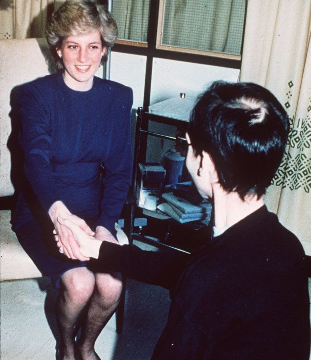 Diana, Princess of Wales, shakes hands with an AIDS victim as she opens a new AIDS ward at the Middlesex Hospital in April 1987 in London.