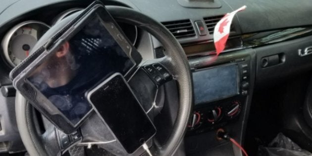 Police in Vancouver caught a driver who'd strapped a tablet and iPhone to his steering wheel.