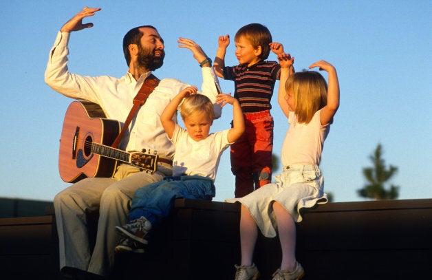 Raffi entertains some children after a concert Sept. 10, 1989.