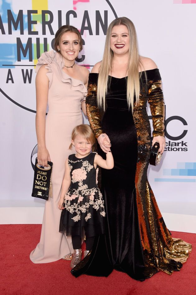 Kelly Clarkson, her stepdaughter Savannah, and her daughter River Rose walk the 2017 AMAs red carpet.