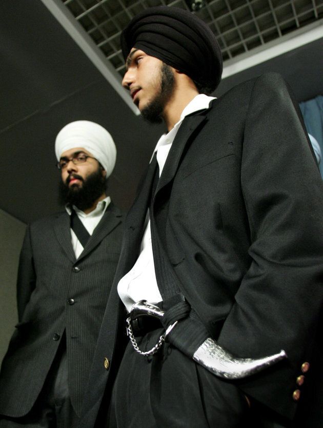 Gurbaj Singh Multani (right) wears a ceremonial dagger, known as a kirpan, after a news conference on Parliament Hill in Ottawa on March 2, 2006.