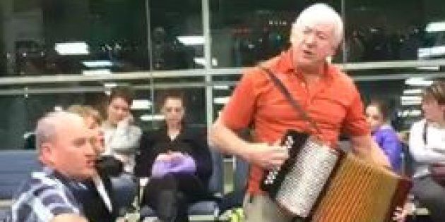 Musicians Sean Sullivan and Sheldon Thornhill busted out their instruments to entertain the crowd waiting for a flight in Toronto's Pearson Airport.