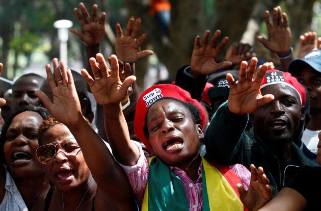 Protesters calling for Zimbabwean President Robert Mugabe to resign attend a prayer meeting outside parliament in Harare, Zimbabwe onNov. 21, 2017.