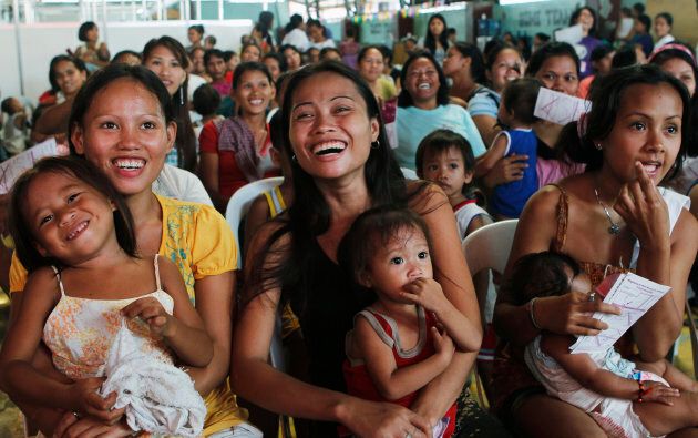 Participants take part in a family planning session in the residential district of Baseco, Manila on July 11, 2012.
