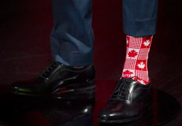 Maple Leaf socks are shown on a wax sculpture of Prime Minister Justin Trudeau during a ceremony at the Grevin museum in Montreal on Nov. 21, 2017.