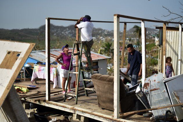Wilson Hernandez and his family rebuild their house destroyed by Hurricane Maria in Puerto Rico on Sepp. 26, 2017.