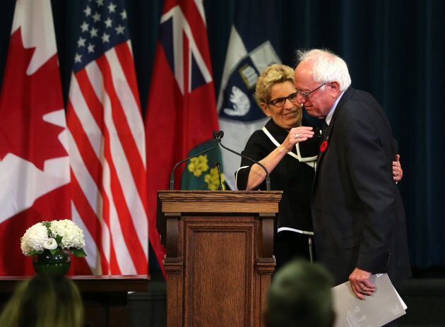 Ontario Premier Kathleen Wynne welcomes Vermont Senator Bernie Sanders at the University of Toronto where he delivered a talk on Canadian health care on Oct. 29, 2017.